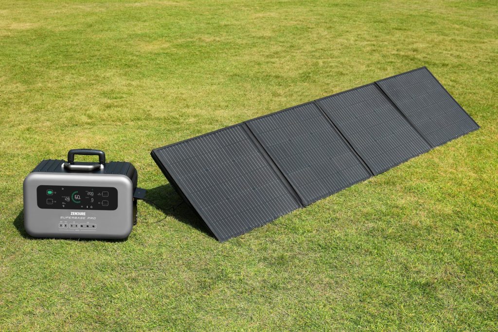 a solar panel and a portable charger on the grass